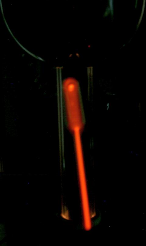 Holding neon tube near Van de Graaff generator